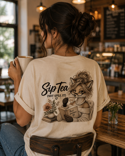Sip Tea (Not Spill It) Tee — Cozy Booklover Cat Graphic T-Shirt